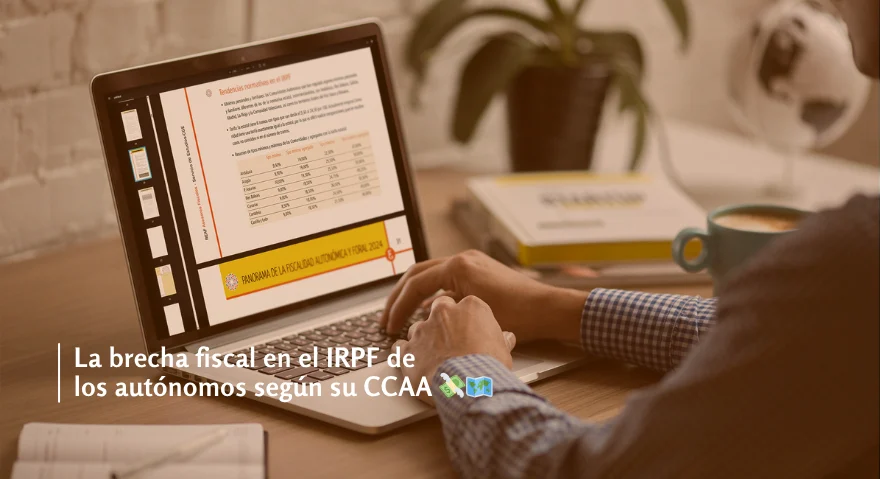 Persona revisando en su portátil un informe sobre fiscalidad autonómica con un gráfico comparativo del IRPF, acompañado de un mensaje en pantalla que destaca: 